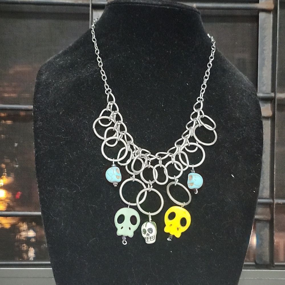 Repurposed Fiesta of Skulls metal hoop statement necklace with clasp enclosure